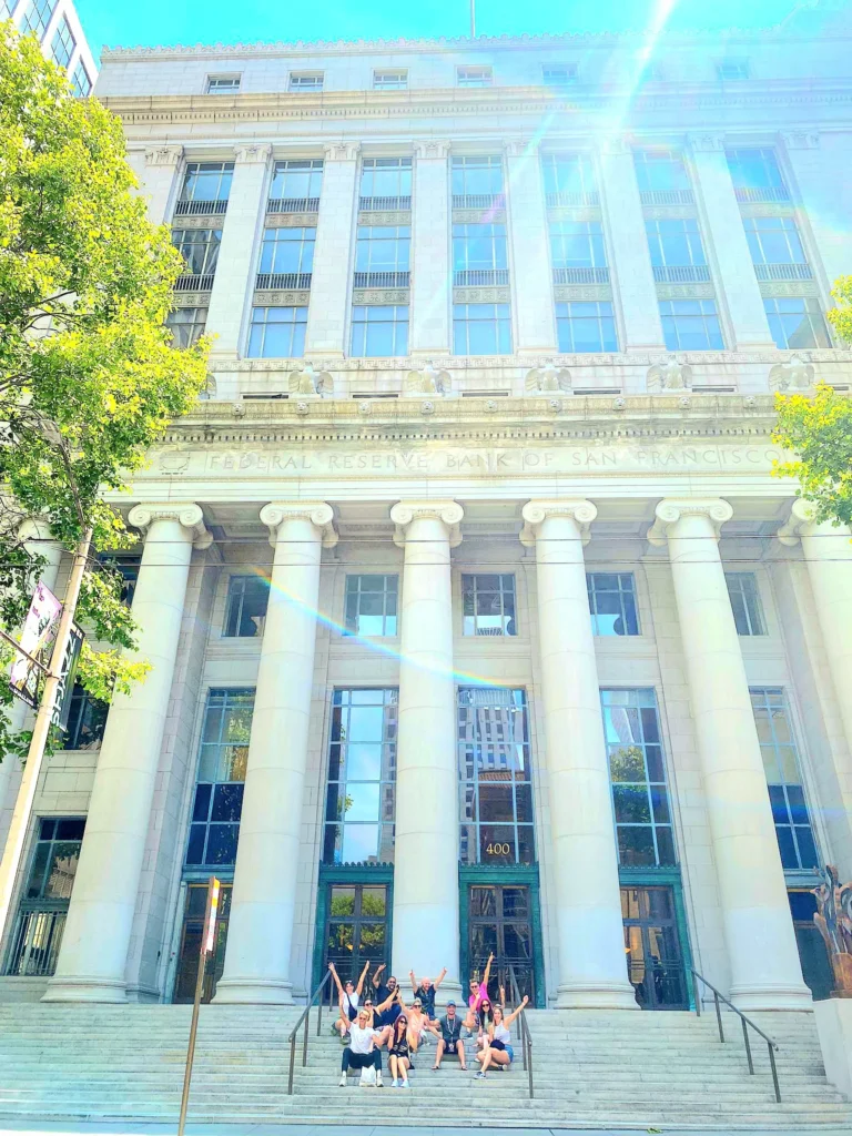 Free walking tour group on the steps of the Federal Reserve Bank of San Francisco in the Financial District